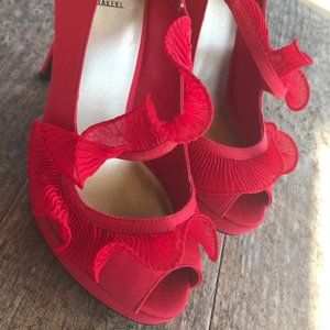 Red women’s high heels by Baker